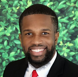 Group of diverse women and men leaders and entrepreneurs in a professional setting, engaged in conversation 